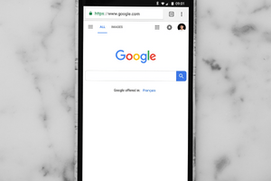 a phone showing google screen. Learn how to get free traffic to your website with google blog post