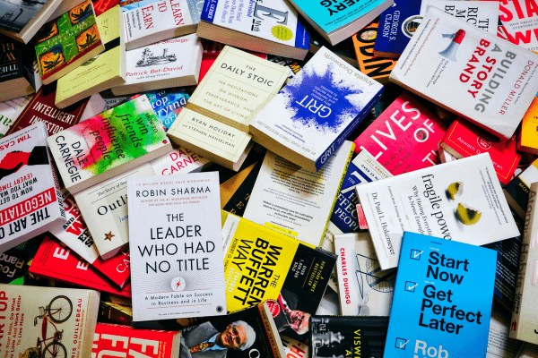 a pile of self improvement books