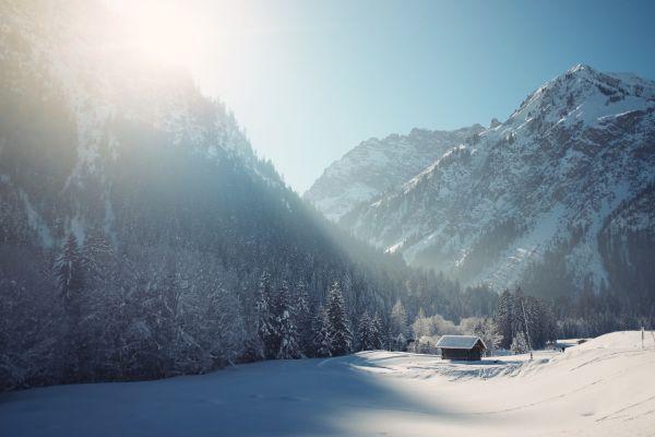 Winter landscape with a house in the mountains. The photo is part of winter blog post ideas article