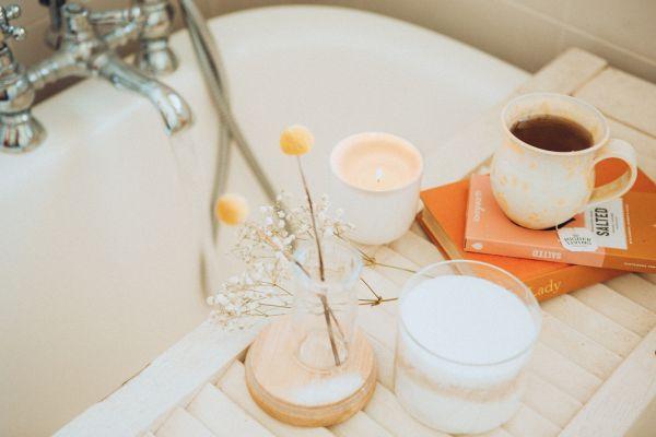 bath tube with cup of coffee, candle and further self care gifts for women ideas for Sunday rituals and more