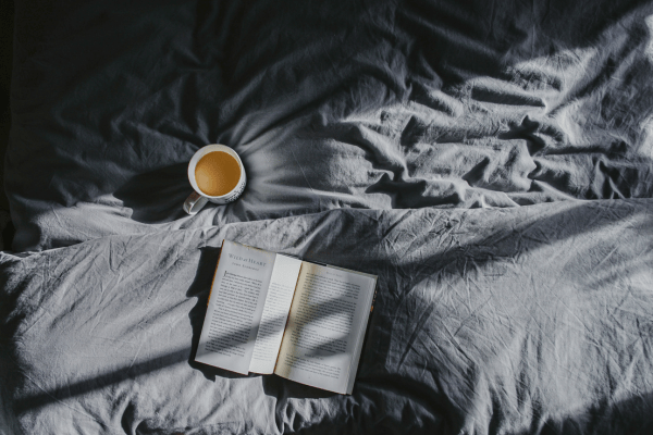 bed sheets, coffee and a journal for the morning routine and reflections