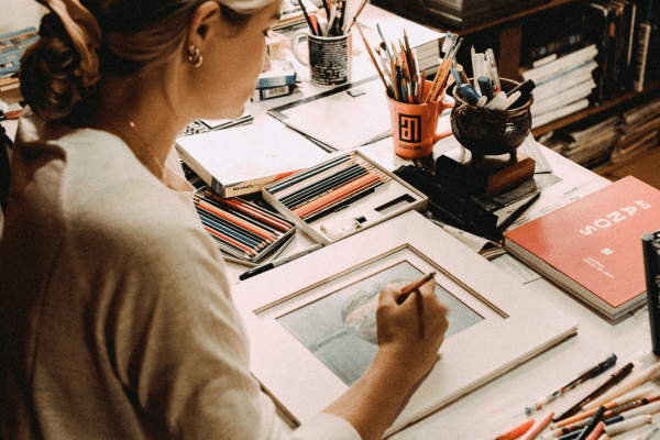 a girl painting as part of an art therapy. Creative healing ideas